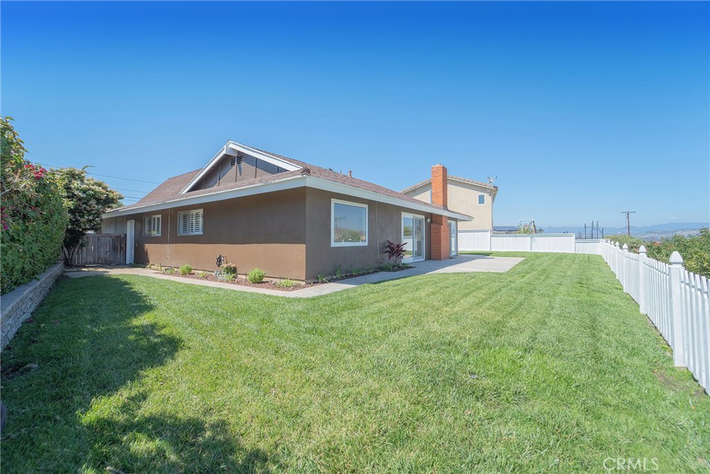 25276 Barque Way Dana Point, CA 92629 - Photo 50 of 61 a front view of house with yard and trees in the background