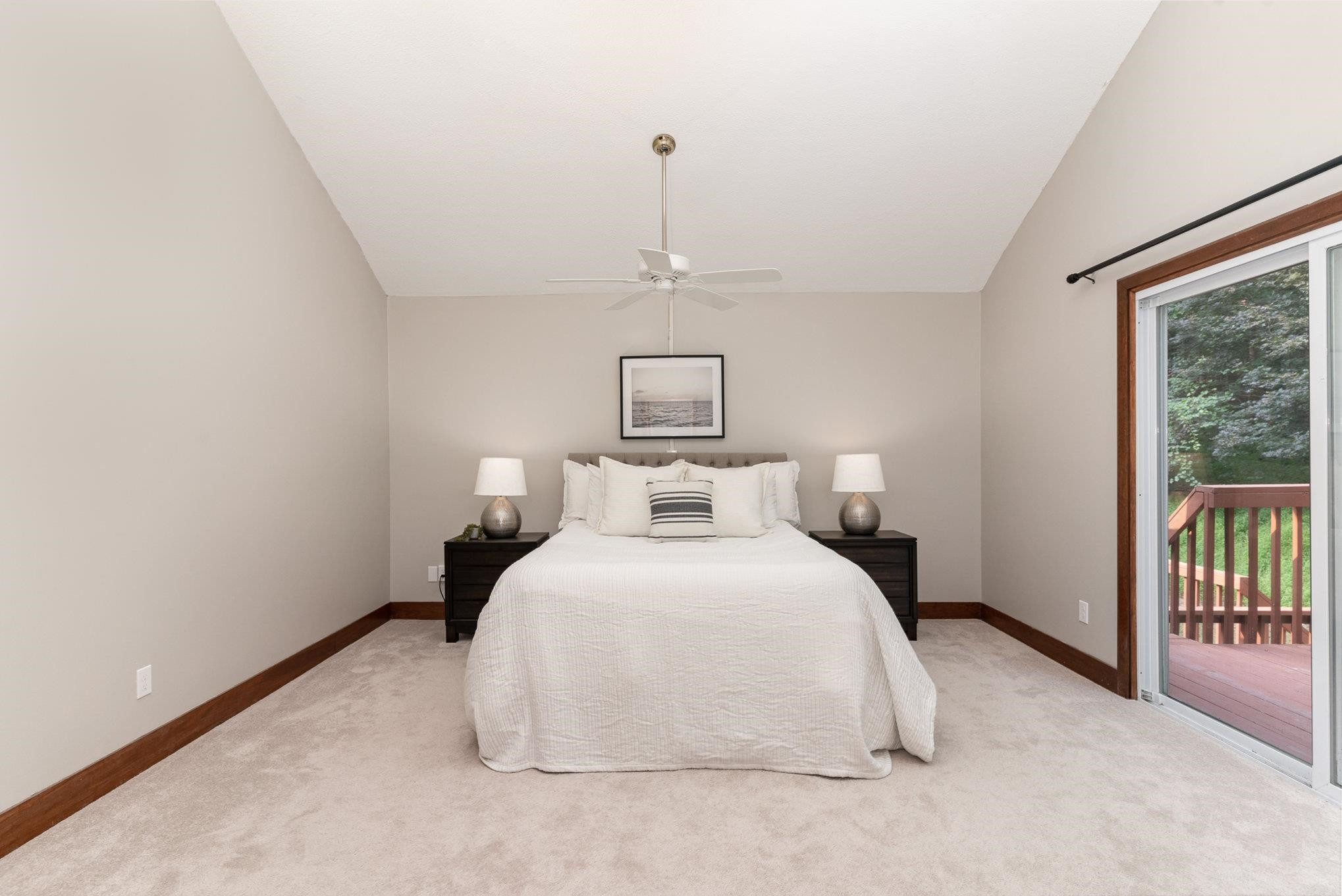 9413 Springdale Drive Raleigh, NC 27613 - Photo 12 of 24 a bedroom with a bed and a large window