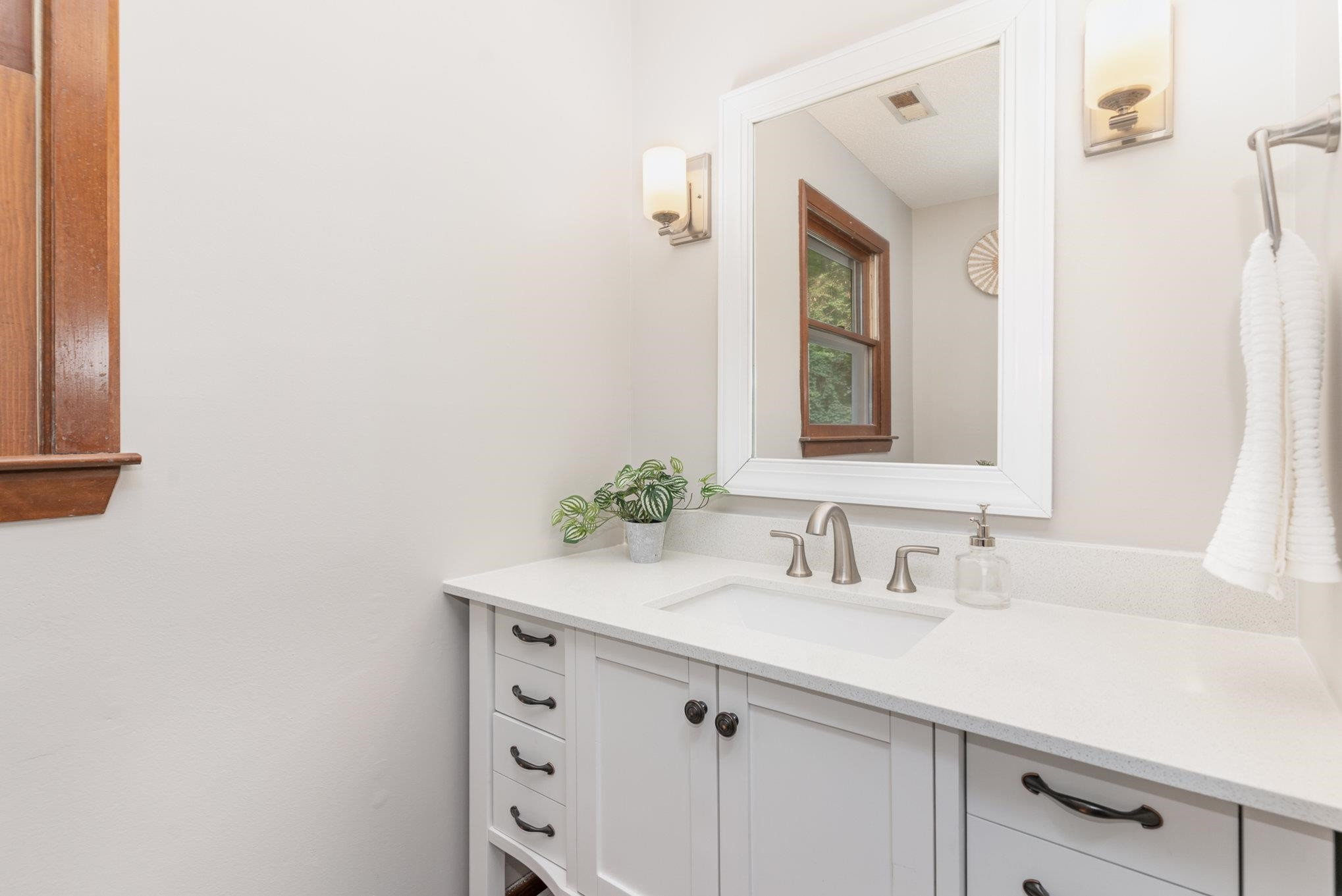 9413 Springdale Drive Raleigh, NC 27613 - Photo 16 of 24 a bathroom with a sink and a mirror