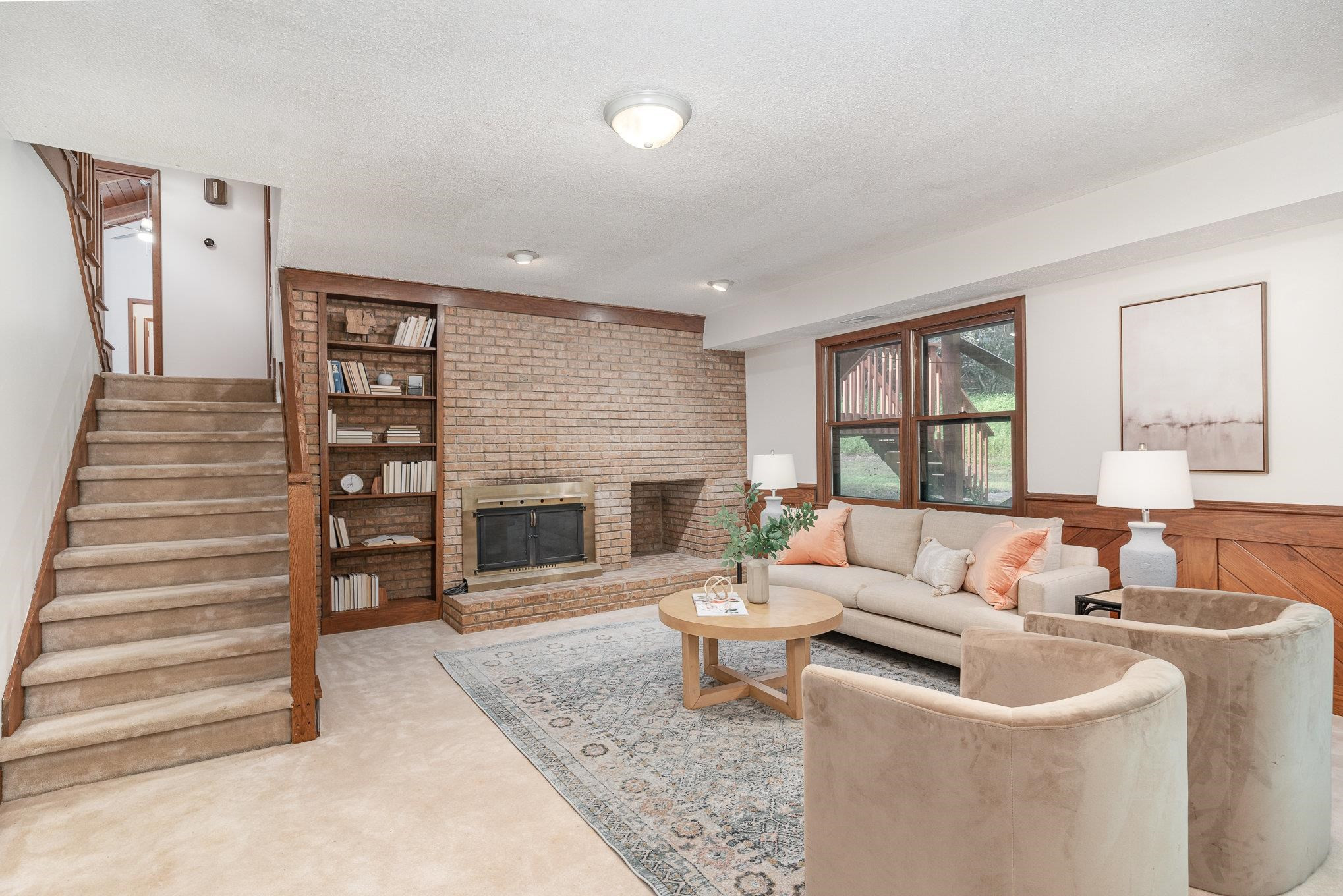 9413 Springdale Drive Raleigh, NC 27613 - Photo 17 of 24 a living room with furniture and a fireplace
