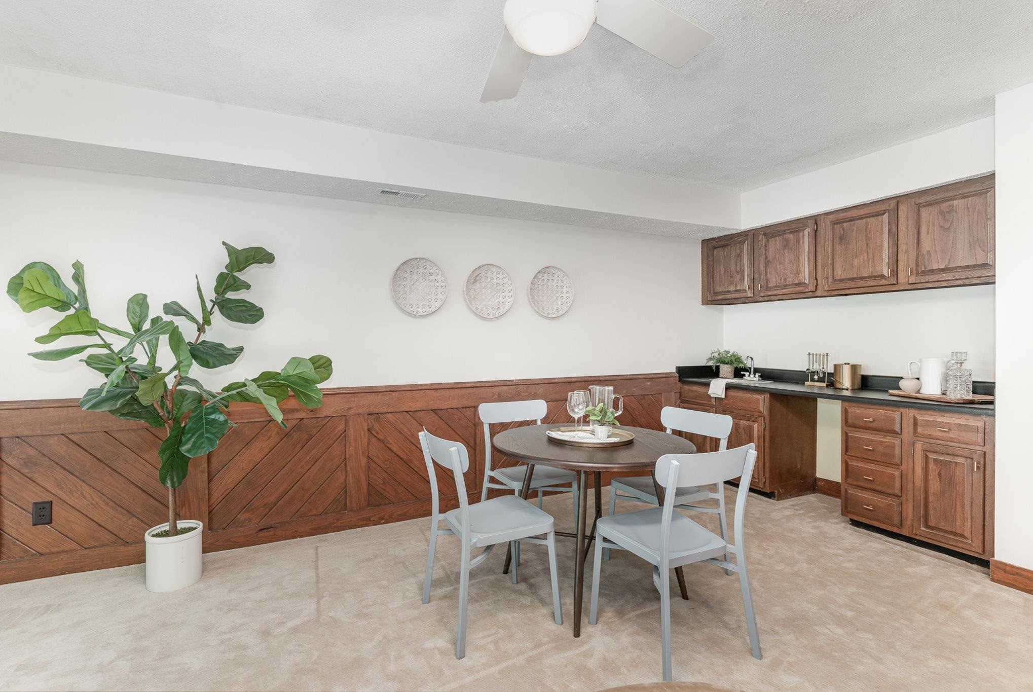 9413 Springdale Drive Raleigh, NC 27613 - Photo 18 of 24 a dining room with furniture and potted plant