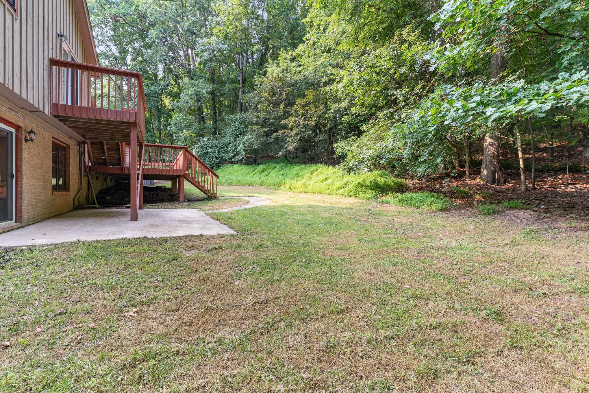 9413 Springdale Drive Raleigh, NC 27613 - Photo 24 of 24 a view of a backyard with a trampoline