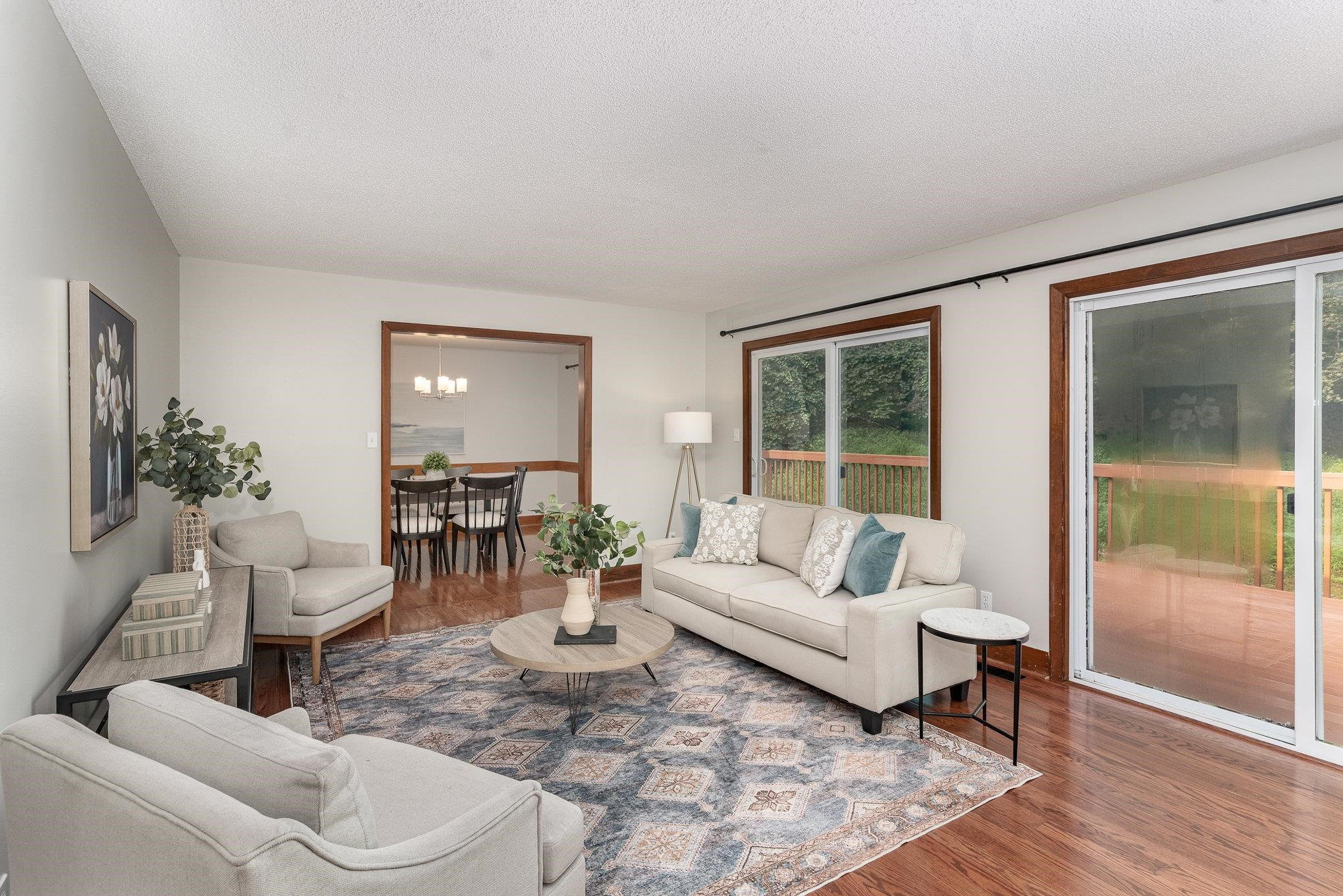 9413 Springdale Drive Raleigh, NC 27613 - Photo 7 of 24 a living room with furniture and a large window