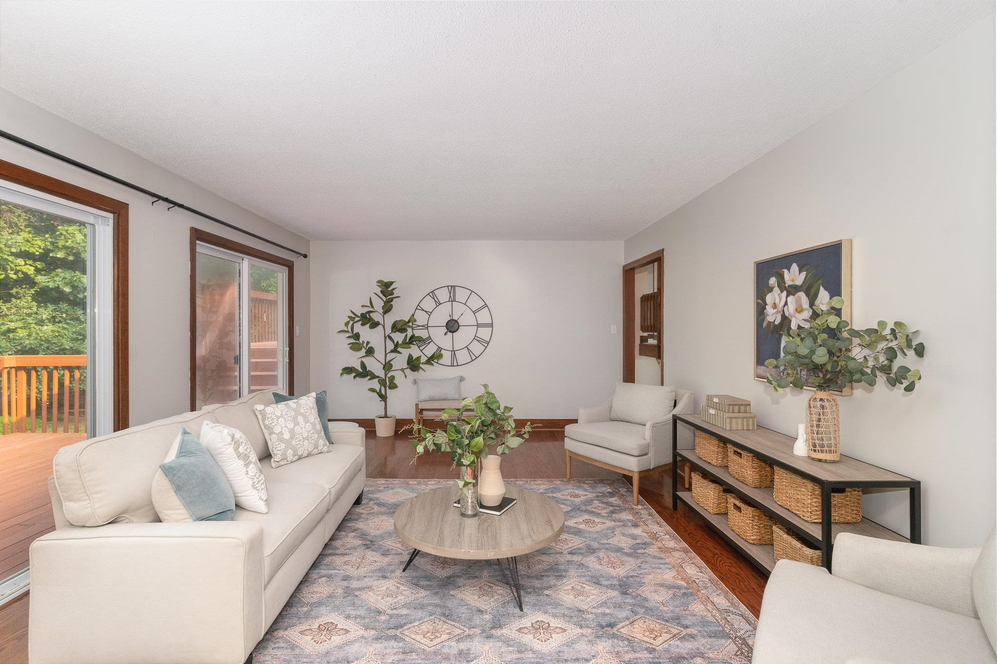 9413 Springdale Drive Raleigh, NC 27613 - Photo 8 of 24 a living room with furniture and a potted plant