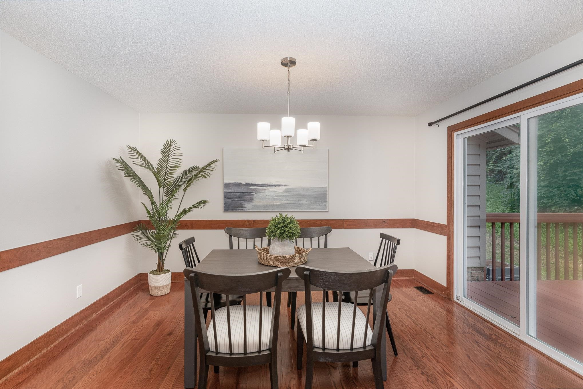 9413 Springdale Drive Raleigh, NC 27613 - Photo 9 of 24 a view of a dining room with furniture window and wooden floor