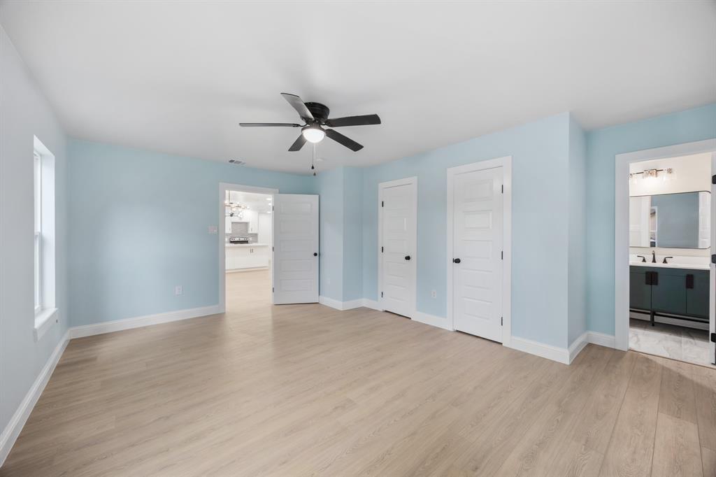 315 South Business Highway 78 Blue Ridge, TX 75424 - Photo 12 of 28 a view of empty room with wooden floor and ceiling fan