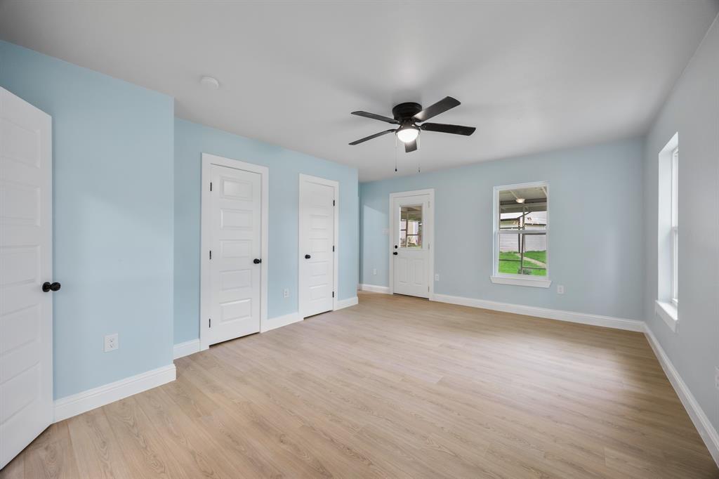 315 South Business Highway 78 Blue Ridge, TX 75424 - Photo 13 of 28 wooden floor in an empty room with a window