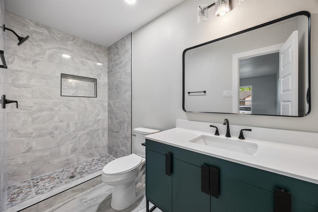 315 South Business Highway 78 Blue Ridge, TX 75424 - Photo 14 of 28 a bathroom with a sink a toilet and shower