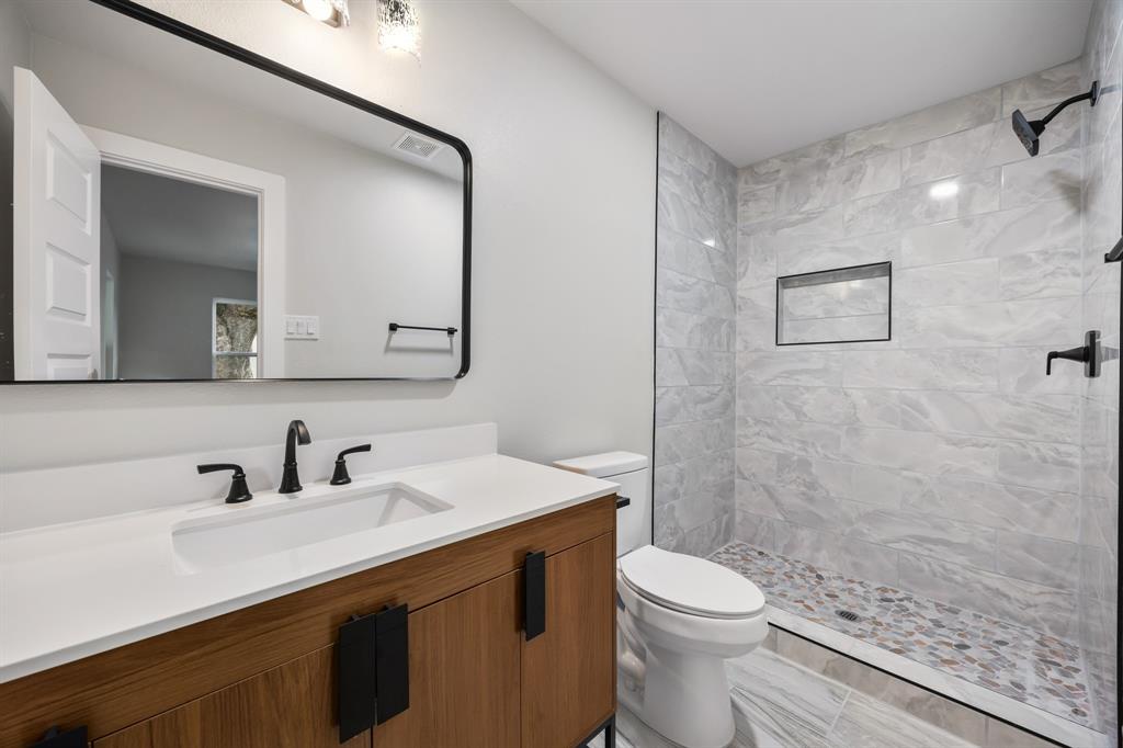 315 South Business Highway 78 Blue Ridge, TX 75424 - Photo 17 of 28 a bathroom with a sink a toilet and shower
