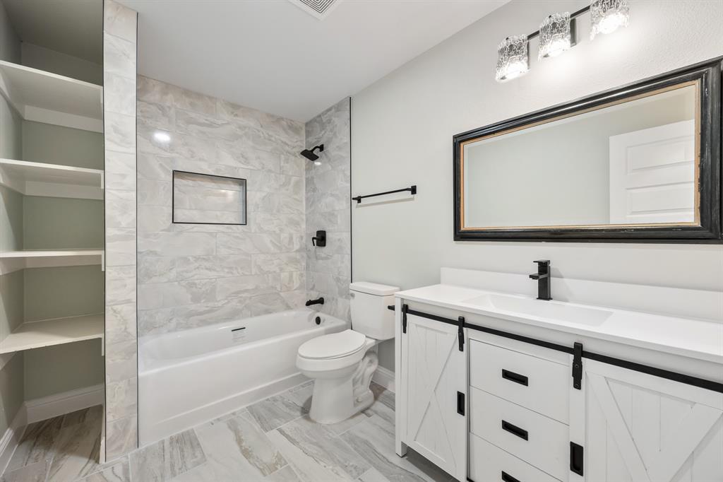 315 South Business Highway 78 Blue Ridge, TX 75424 - Photo 19 of 28 a bathroom with a sink a toilet and shower