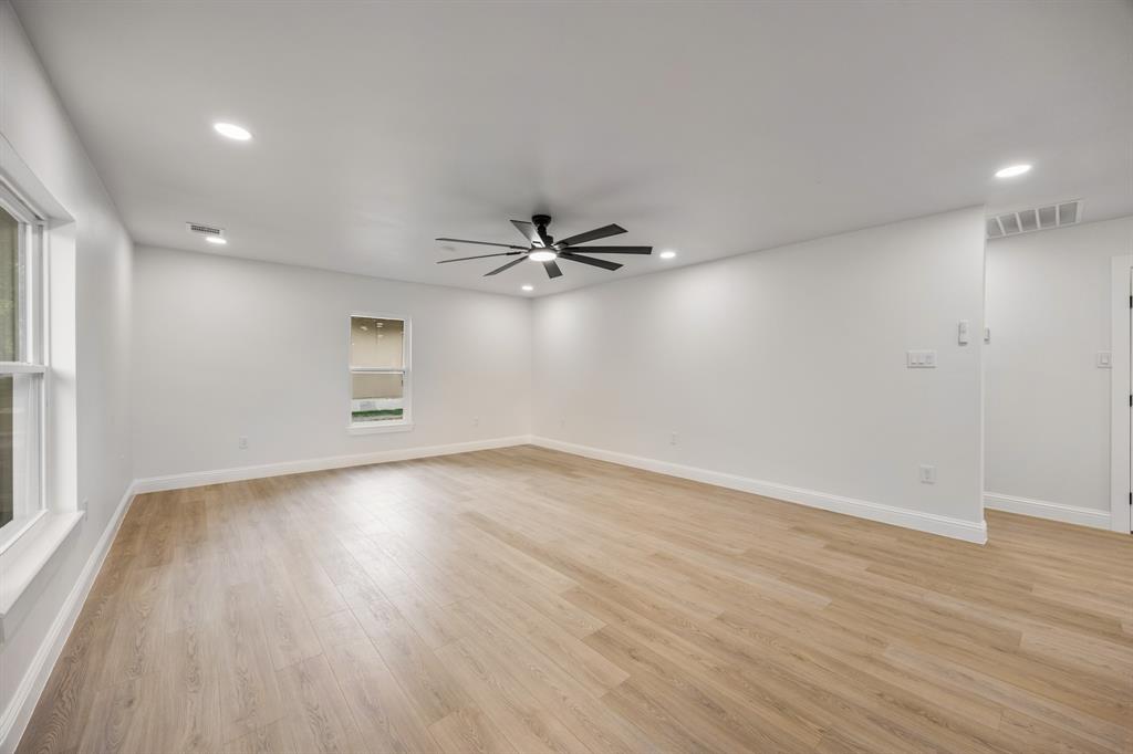 315 South Business Highway 78 Blue Ridge, TX 75424 - Photo 3 of 28 wooden floor in an empty room with a window