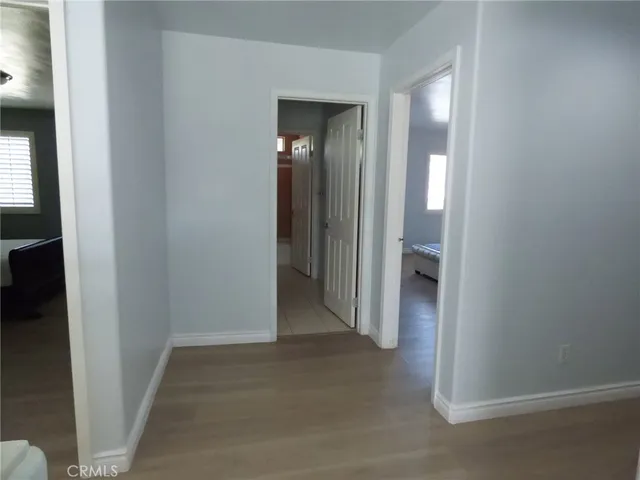 a view of a bedroom from a hallway