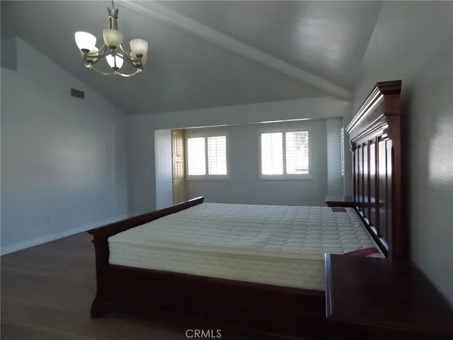 a bathroom with a glass shower door and a sink