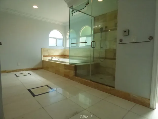 a bathroom with a granite countertop toilet and a shower