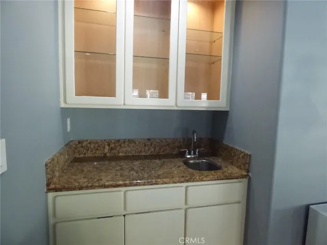 a kitchen with a sink and a window