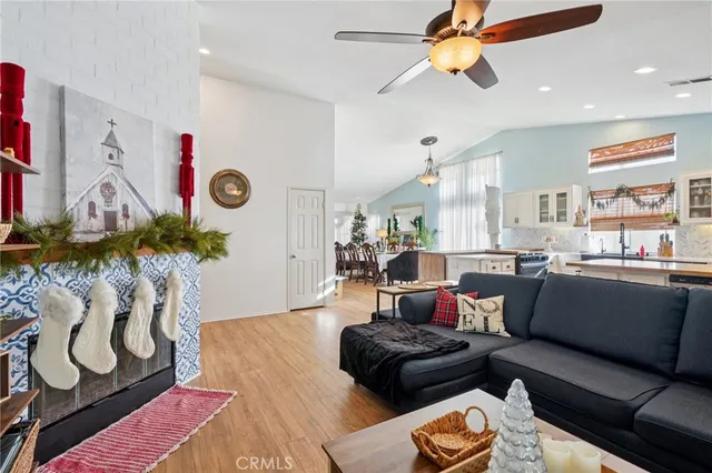 a living room with furniture and a floor to ceiling window