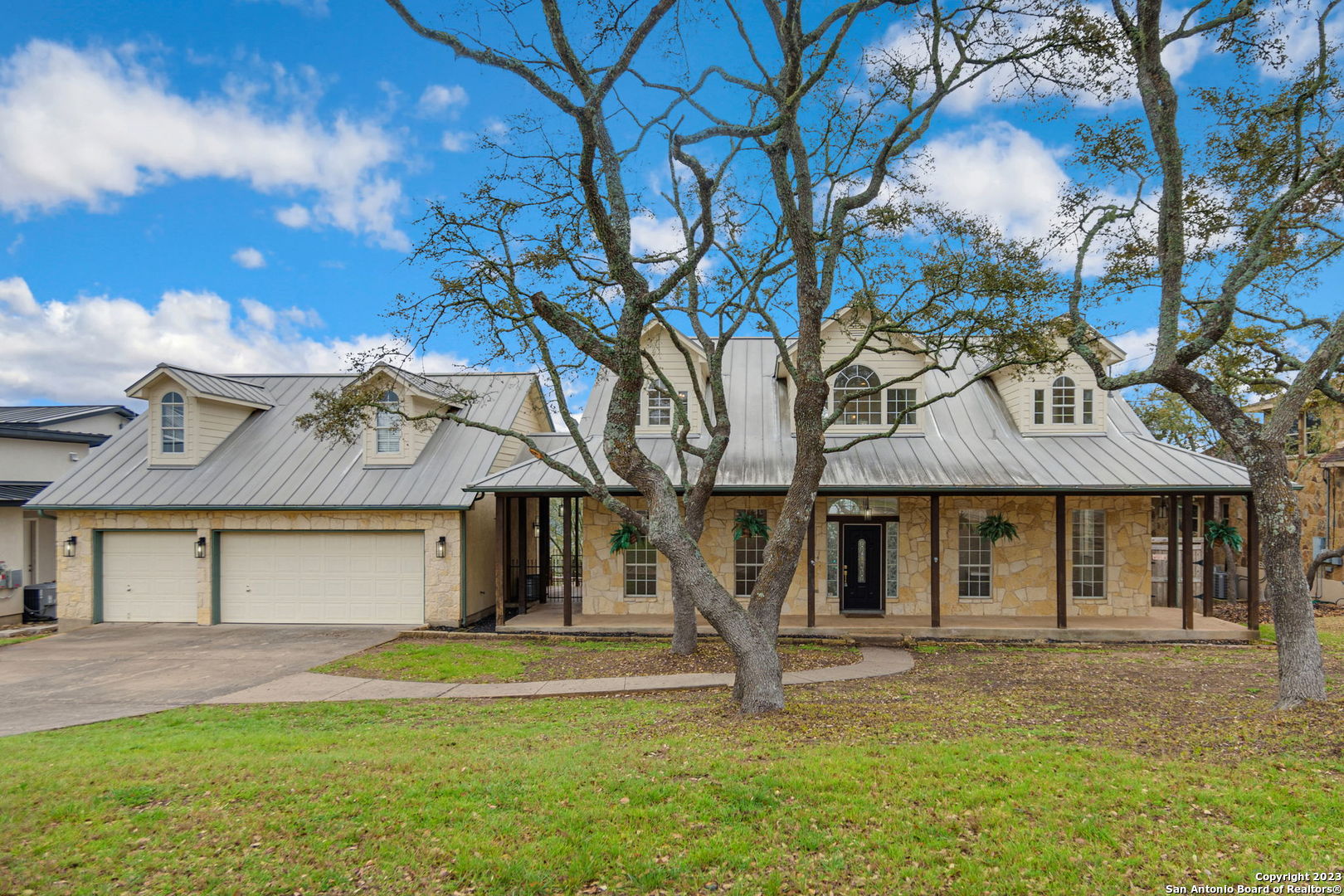 25814 Mt Carillon San Antonio, TX 78260 - Photo 1 of 30 a front view of a house with a garden and yard