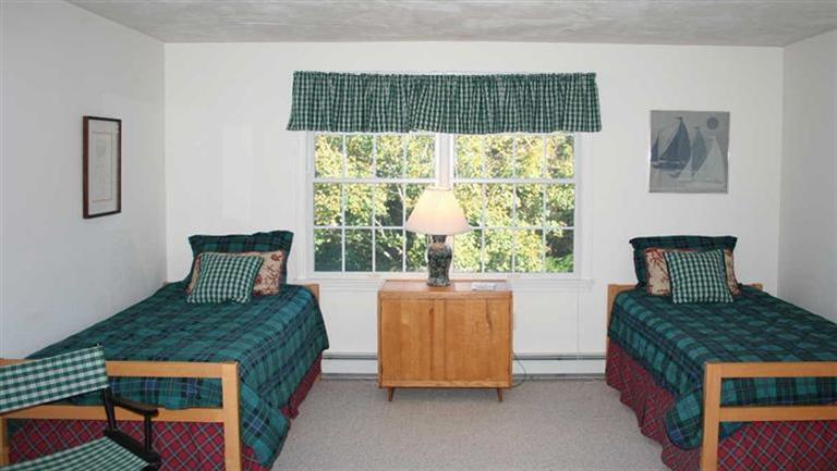 28 Seavers Road Orleans, MA 02653 - Photo 13 of 16 a bedroom with a bed and window