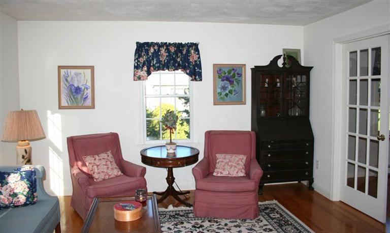 28 Seavers Road Orleans, MA 02653 - Photo 4 of 16 a living room with furniture and wooden floor