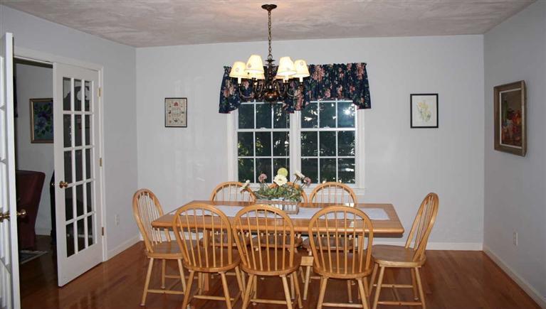 28 Seavers Road Orleans, MA 02653 - Photo 8 of 16 a view of a dining room with furniture window and wooden floor