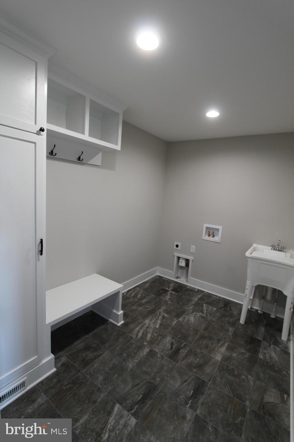 28049 Strawberry Hill Road Rhoadesville, VA 22542 - Photo 16 of 32 Drop zone with tall pantry cabinet with storage.