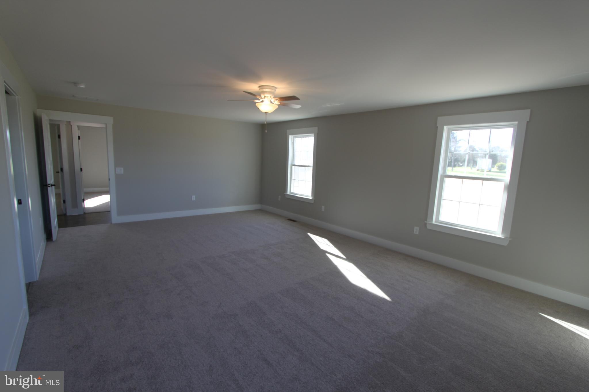 28049 Strawberry Hill Road Rhoadesville, VA 22542 - Photo 20 of 32 Natural light abounds in the primary bedroom.