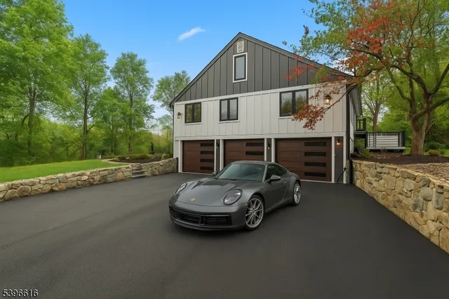 a living room with fireplace furniture and a wooden floor