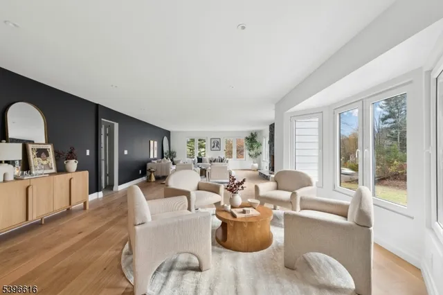 a living room with furniture window and wooden floor