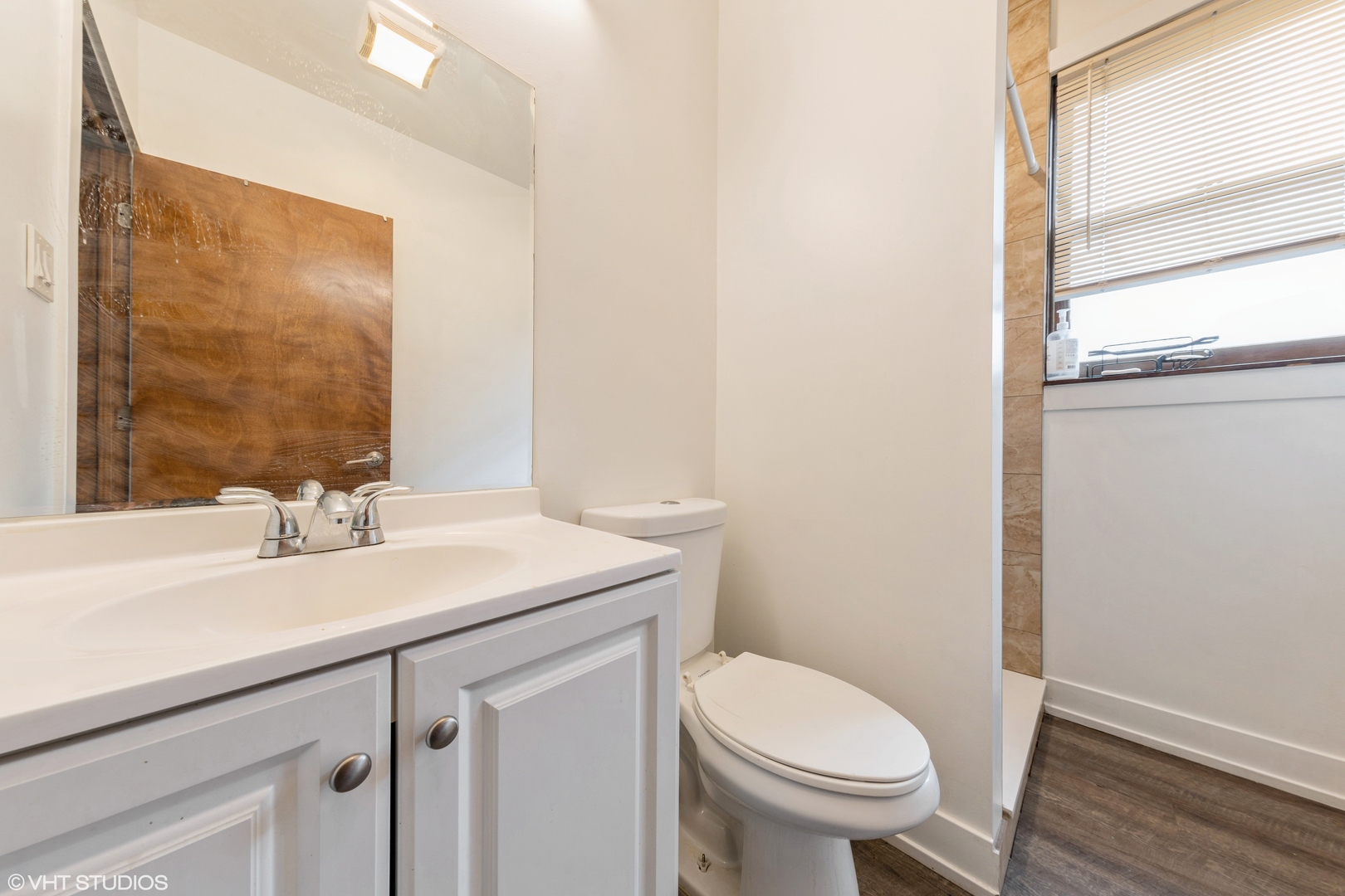 7806 South May Street Chicago, IL 60620 - Photo 14 of 20 a bathroom with a sink and a toilet