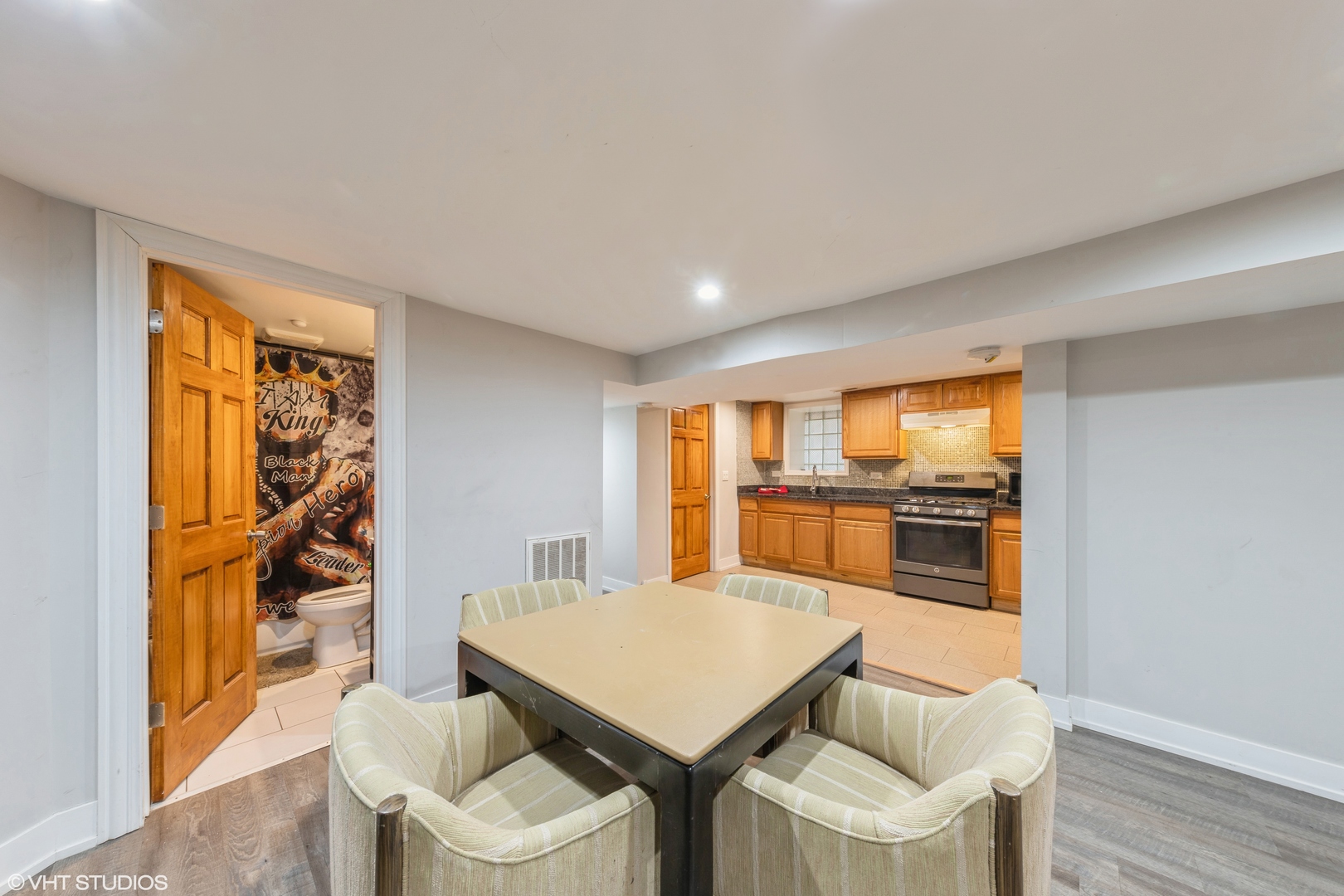 7806 South May Street Chicago, IL 60620 - Photo 2 of 20 a view of a dining room with furniture window and wooden floor