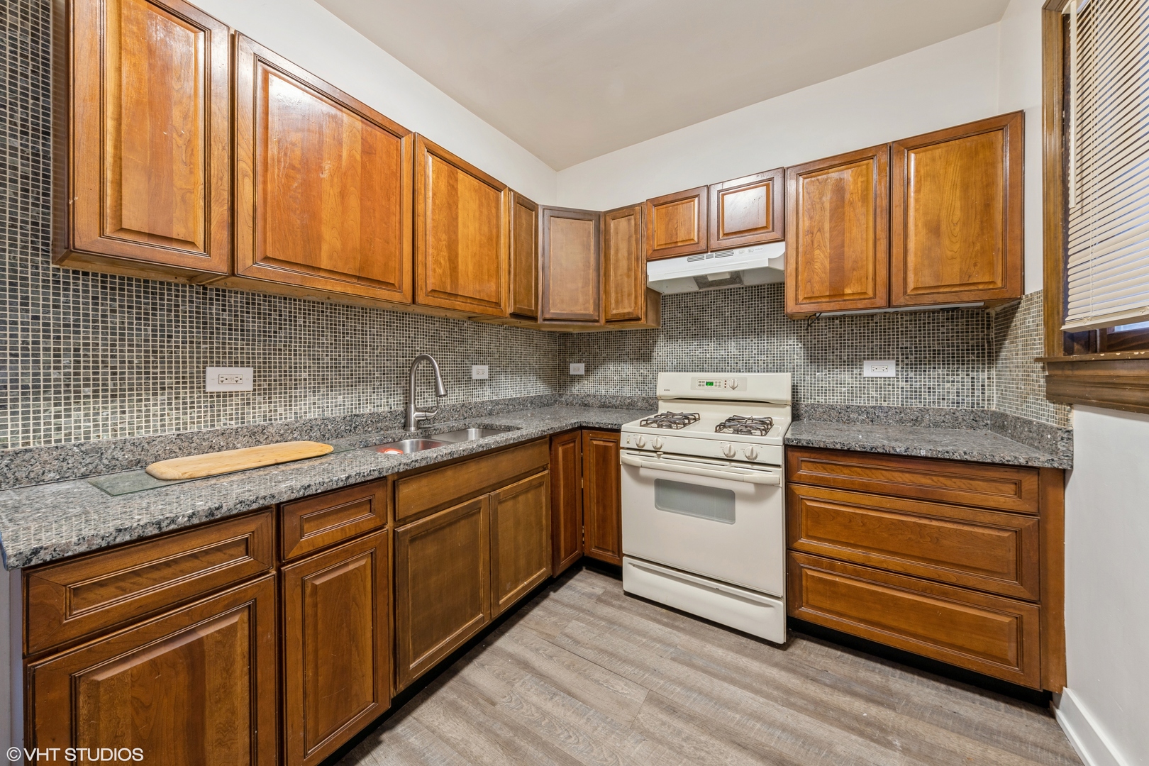 7806 South May Street Chicago, IL 60620 - Photo 7 of 20 a kitchen with stainless steel appliances granite countertop a sink stove and cabinets