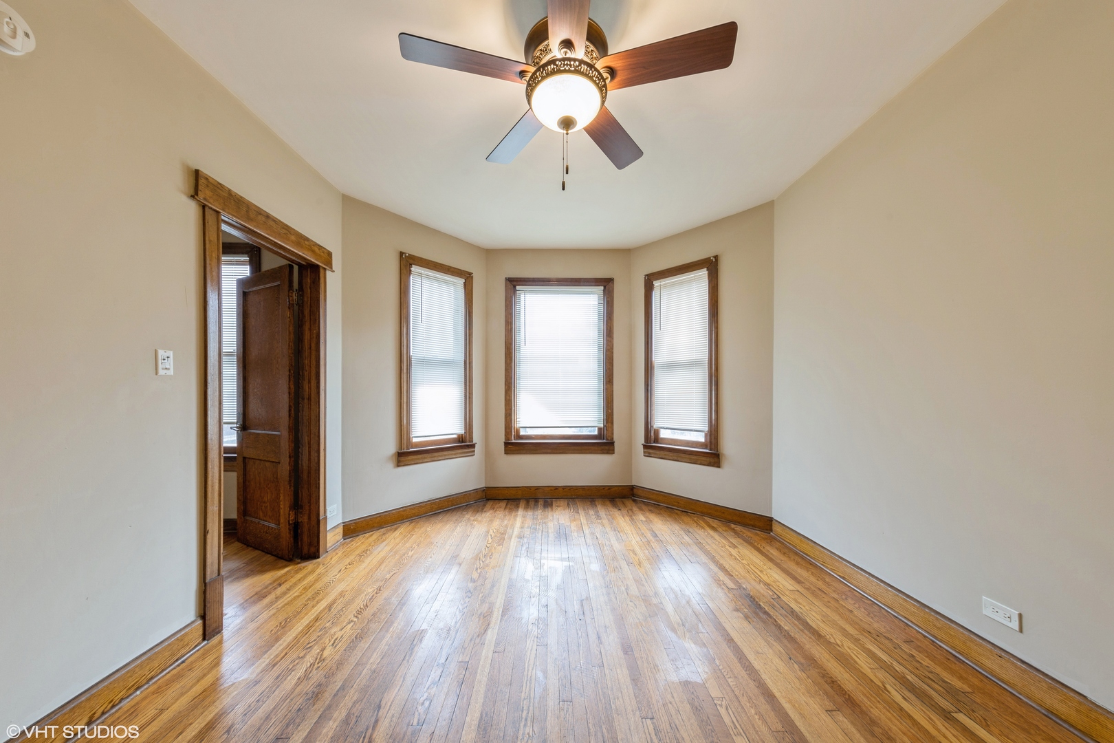 7806 South May Street Chicago, IL 60620 - Photo 8 of 20 wooden floor in an empty room with a window