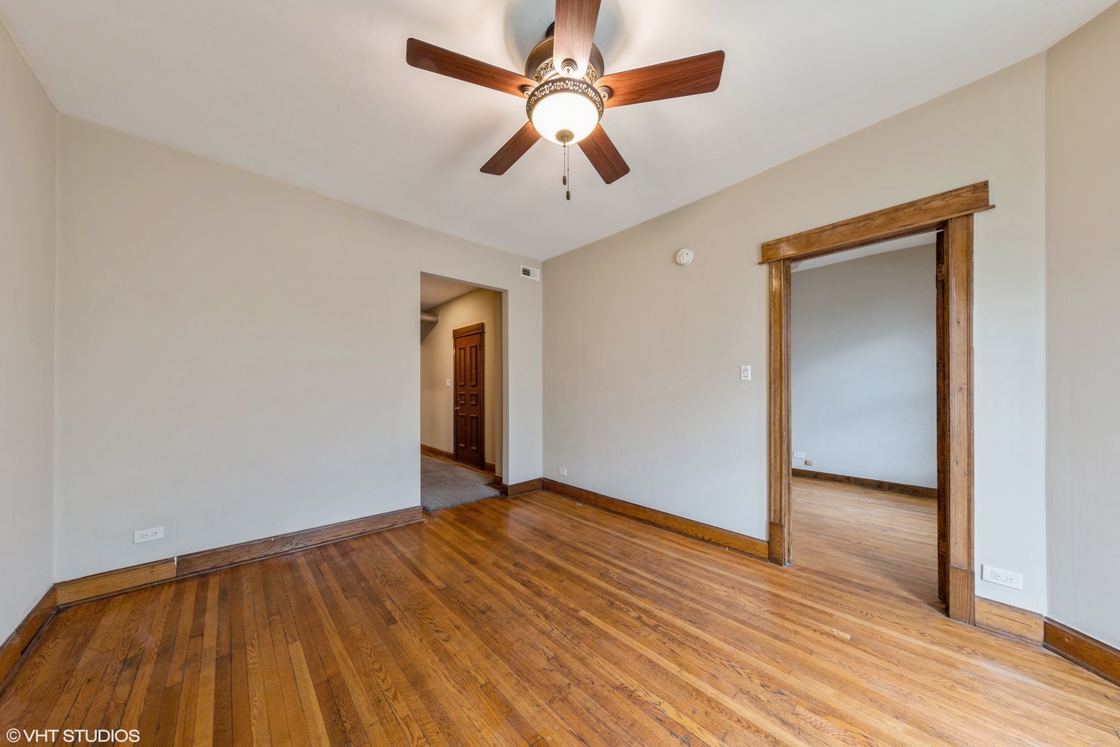 7806 South May Street Chicago, IL 60620 - Photo 10 of 20 wooden floor in an empty room with a window