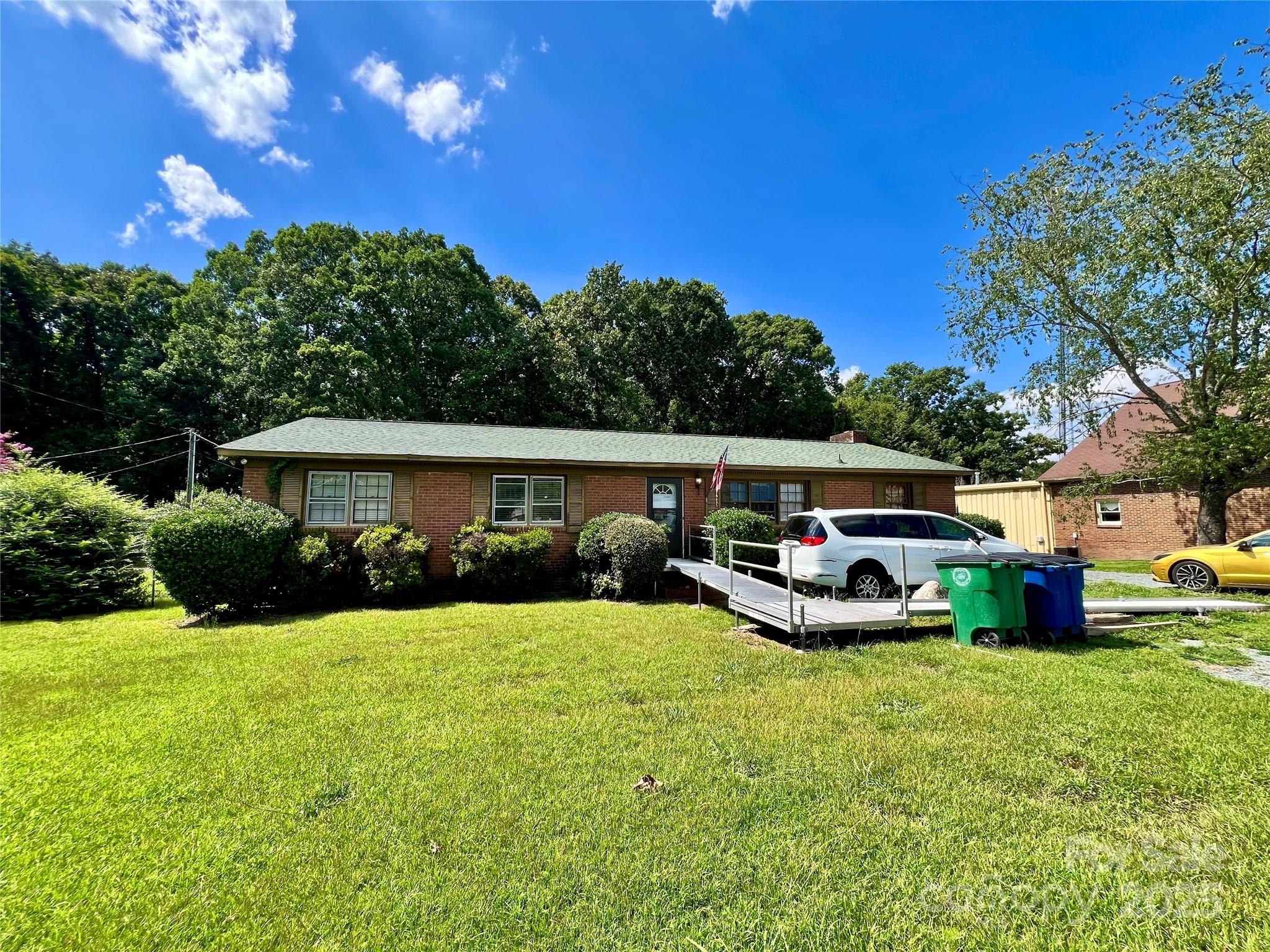1321 Stallings Road Matthews, NC 28104 - Photo 1 of 11 a view of a house with swimming pool and a yard
