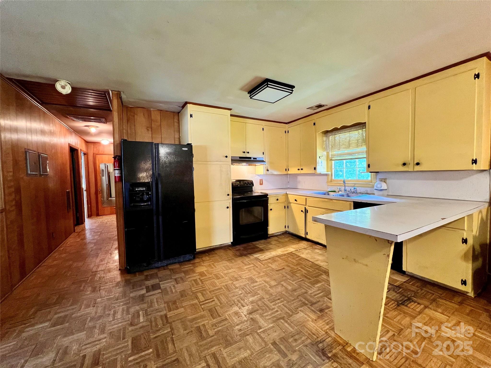 1321 Stallings Road Matthews, NC 28104 - Photo 3 of 11 a kitchen with stainless steel appliances a refrigerator and a sink