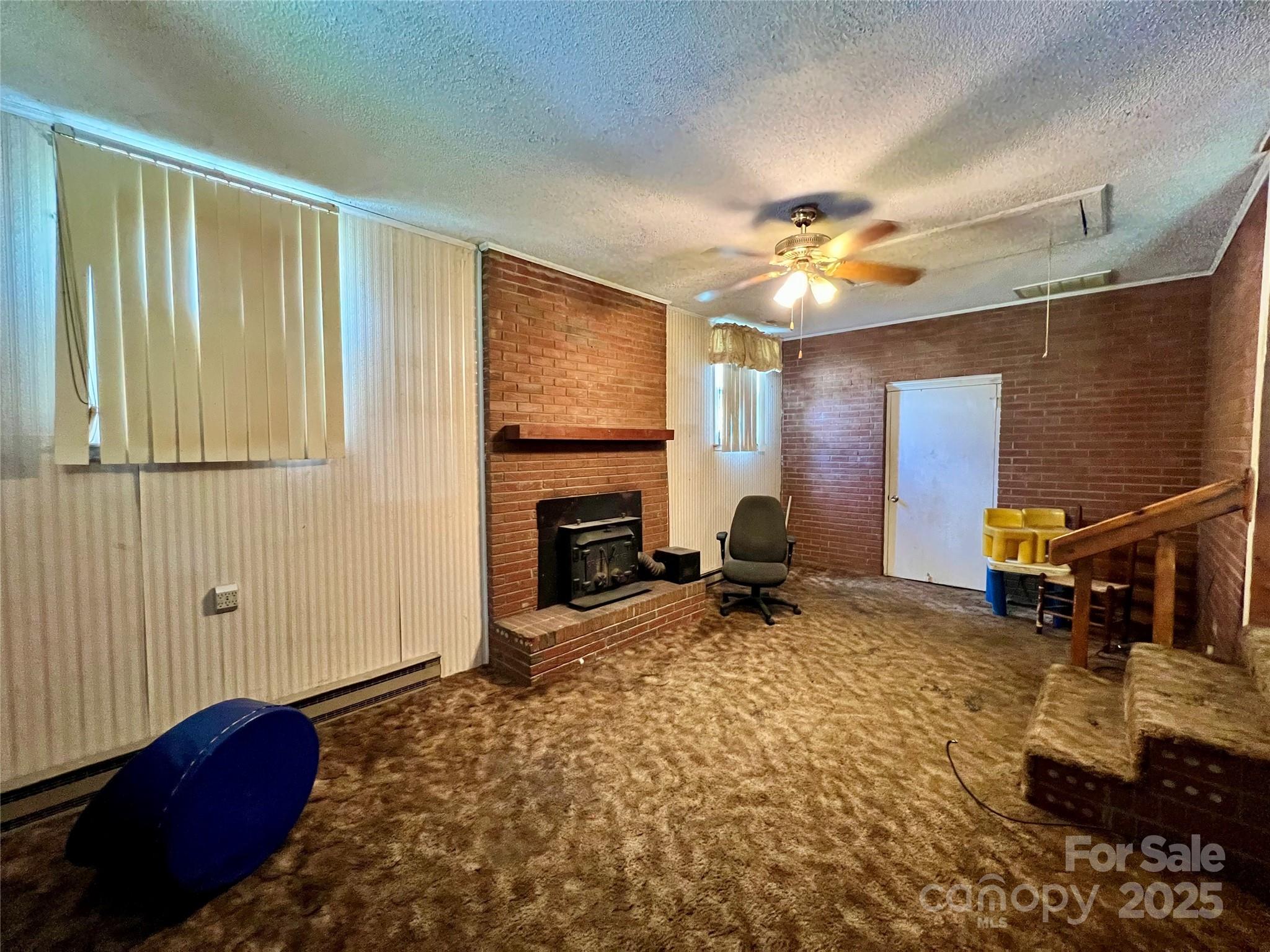 1321 Stallings Road Matthews, NC 28104 - Photo 4 of 11 a bedroom with furniture and a fireplace