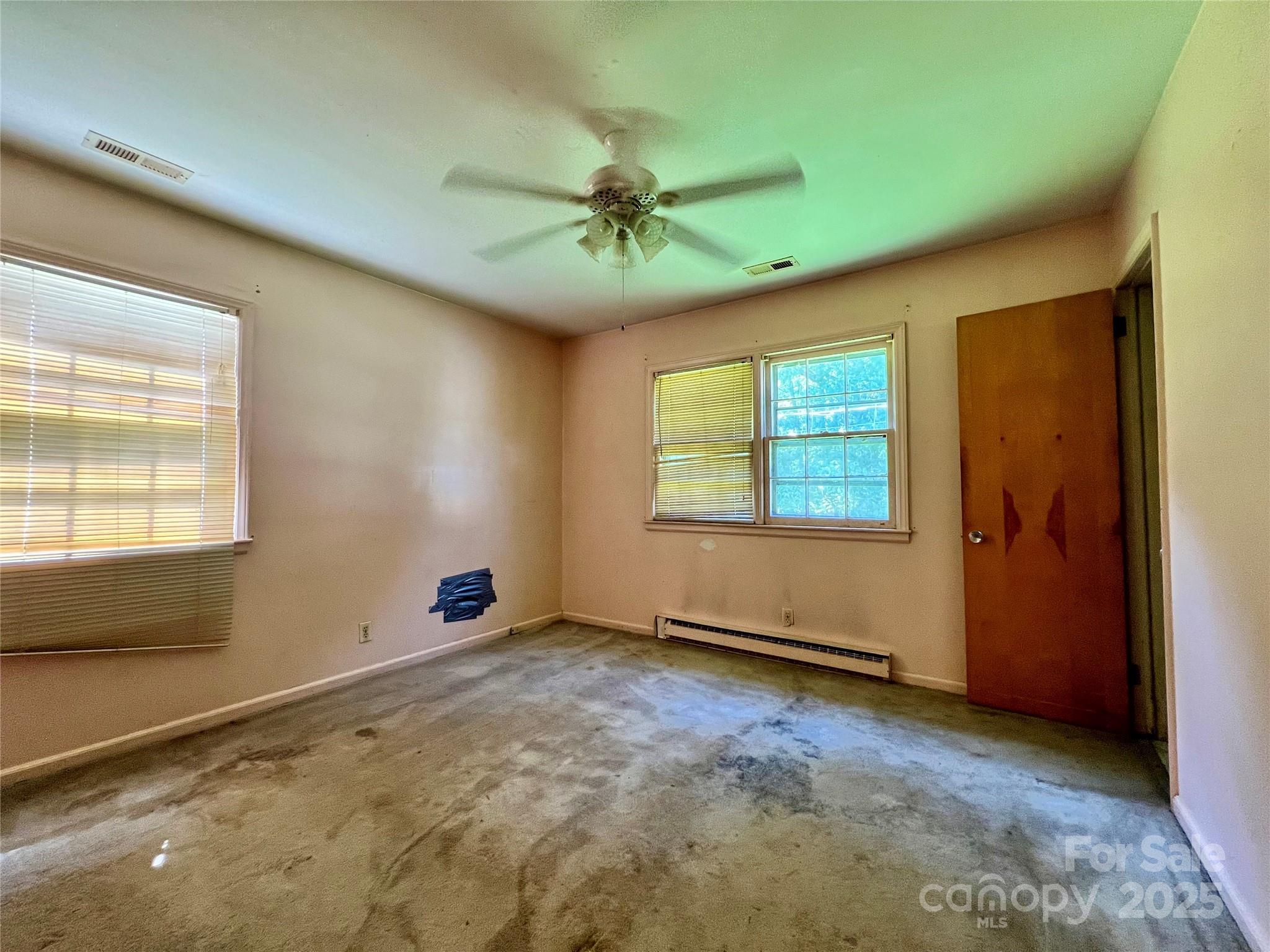 1321 Stallings Road Matthews, NC 28104 - Photo 7 of 11 a view of an empty room with a window