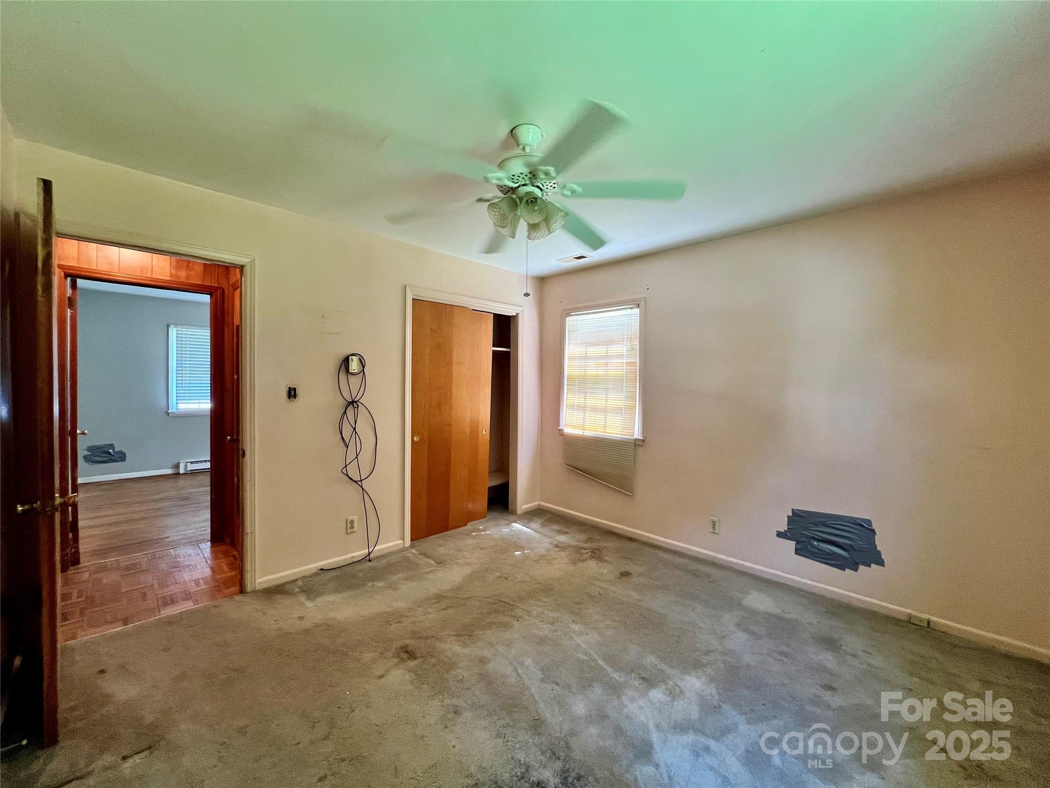 1321 Stallings Road Matthews, NC 28104 - Photo 8 of 11 an empty room with windows and fan