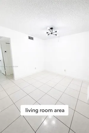 a kitchen with a cabinets and window