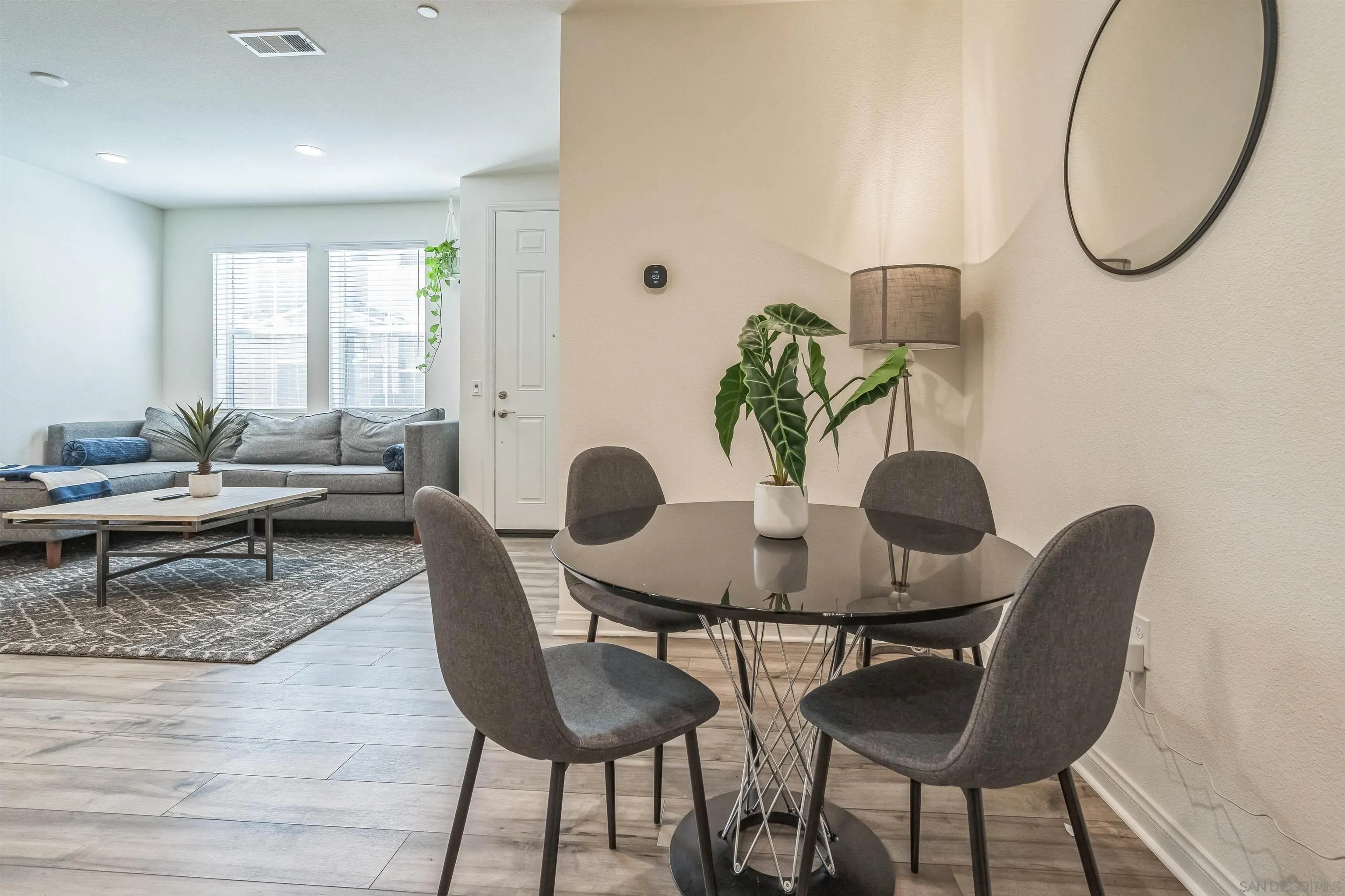 2018 Barite Street Spring Valley, CA 91977 - Photo 26 of 47 a living room with furniture and a mirror