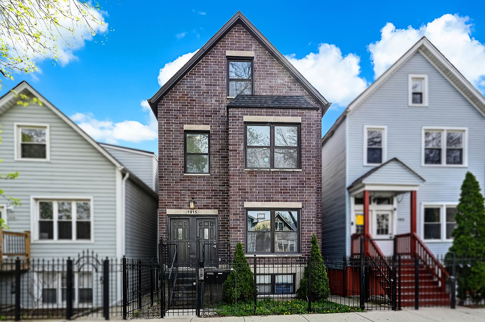 1915 North Francisco Avenue, Unit 2 Chicago, IL 60647 - Photo 1 of 24 a front view of a house with glass windows