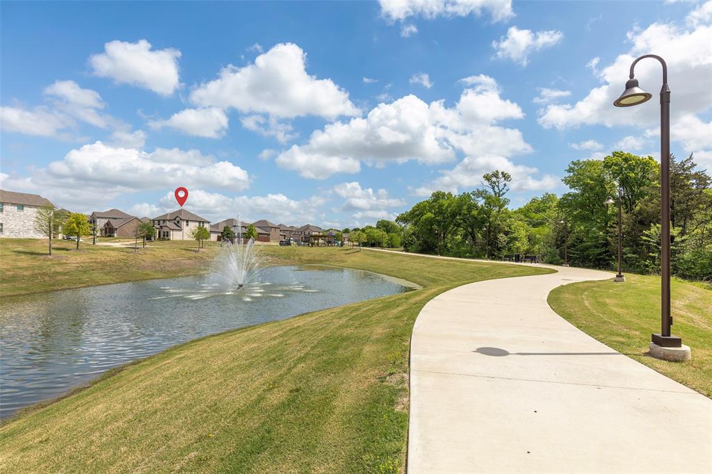 1504 Cobblestone Road Melissa, TX 75454 - Photo 4 of 39 Aerial view of a well-located home on one of the neighborhood’s most desirable lots, with the park, pond, and trails just outside your door. A home that brings together comfort, connection, and room to make lasting memories.