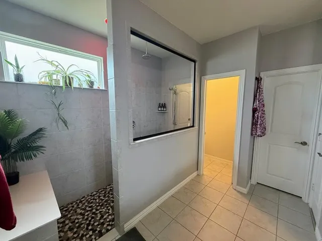 a bathroom with a shower and a toilet