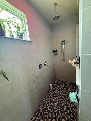 a bathroom with a black white checkered floor