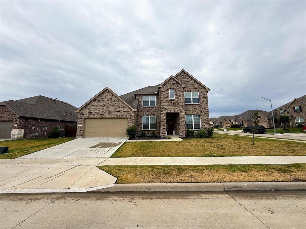 1109 Pinnacle Ridge Road Fort Worth, TX 76052 - Photo 2 of 40 a front view of a house with a yard