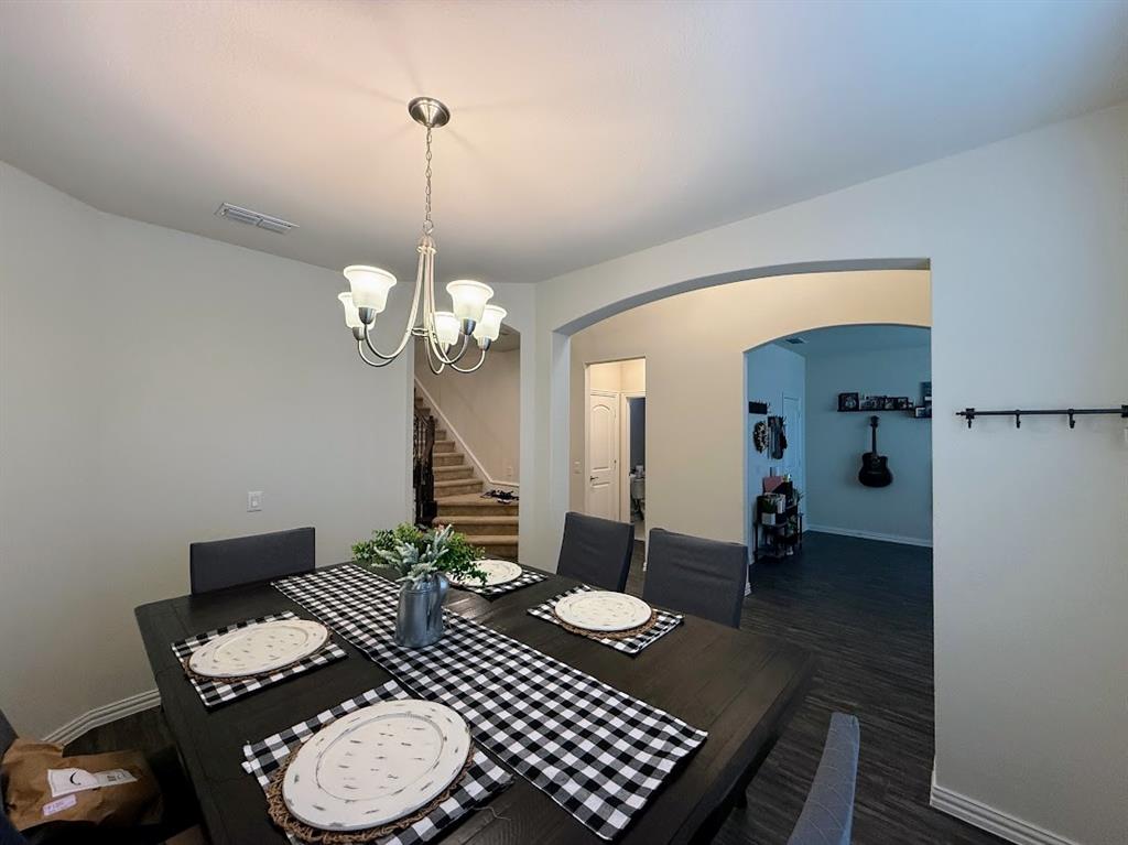 1109 Pinnacle Ridge Road Fort Worth, TX 76052 - Photo 21 of 40 a dining room with furniture and wooden floor