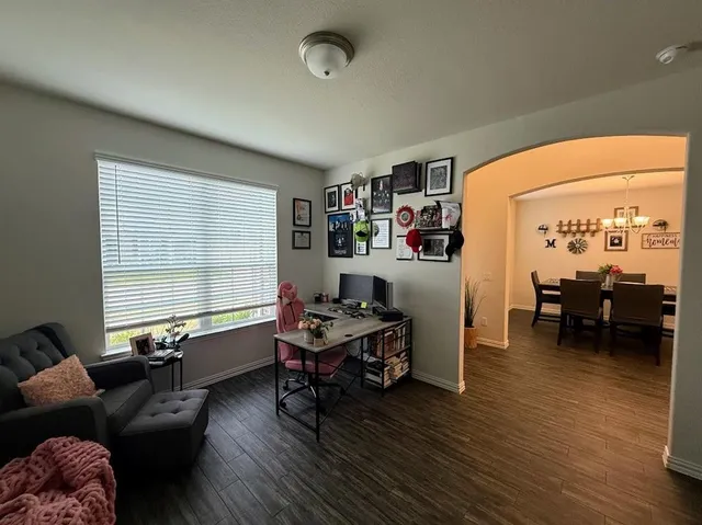 a livingroom with furniture and a window