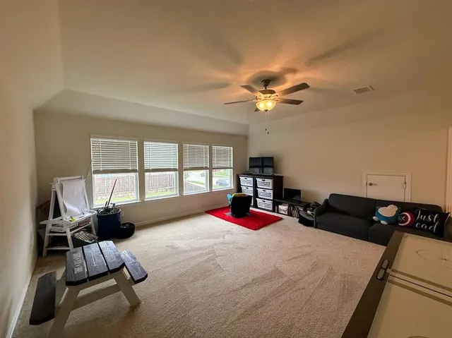 a bedroom with a bed furniture and a window