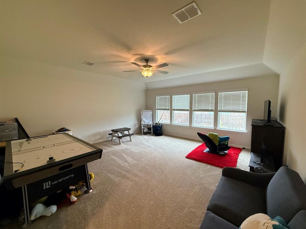 1109 Pinnacle Ridge Road Fort Worth, TX 76052 - Photo 26 of 40 a bed room with a bed furniture and a flat screen tv