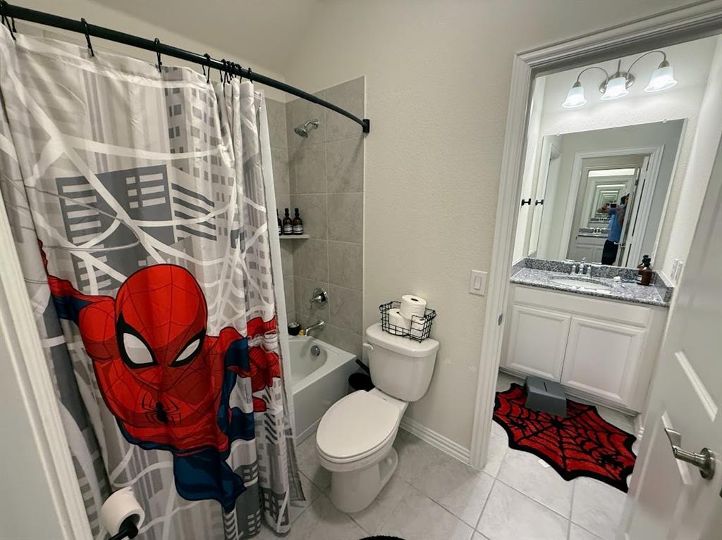 1109 Pinnacle Ridge Road Fort Worth, TX 76052 - Photo 29 of 40 a bathroom with a toilet a sink and a shower
